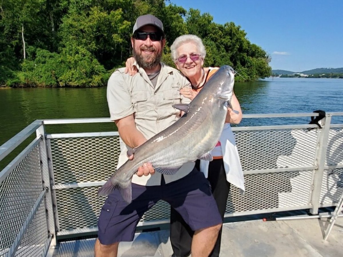 a person holding a fish