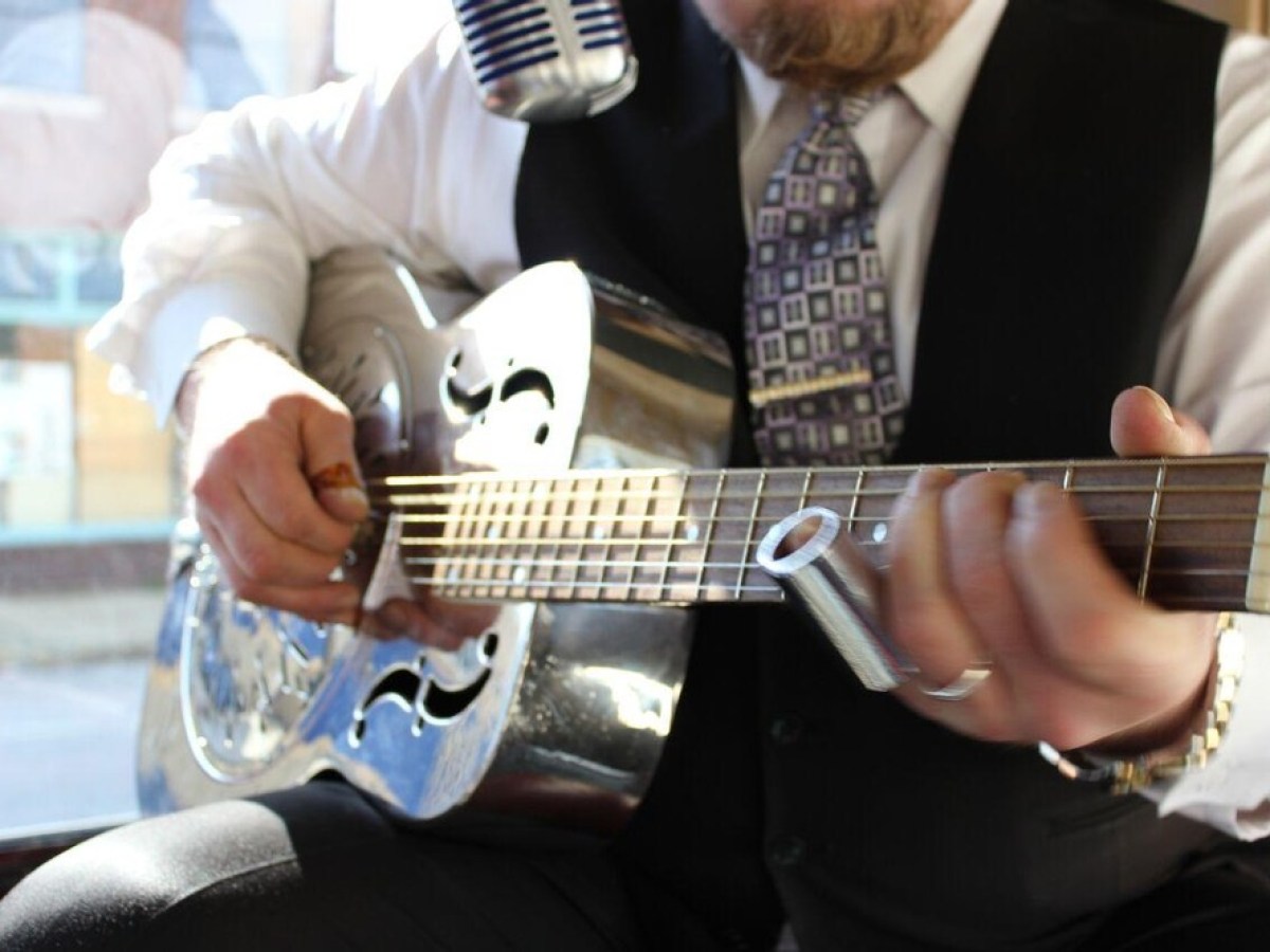 a man holding a guitar