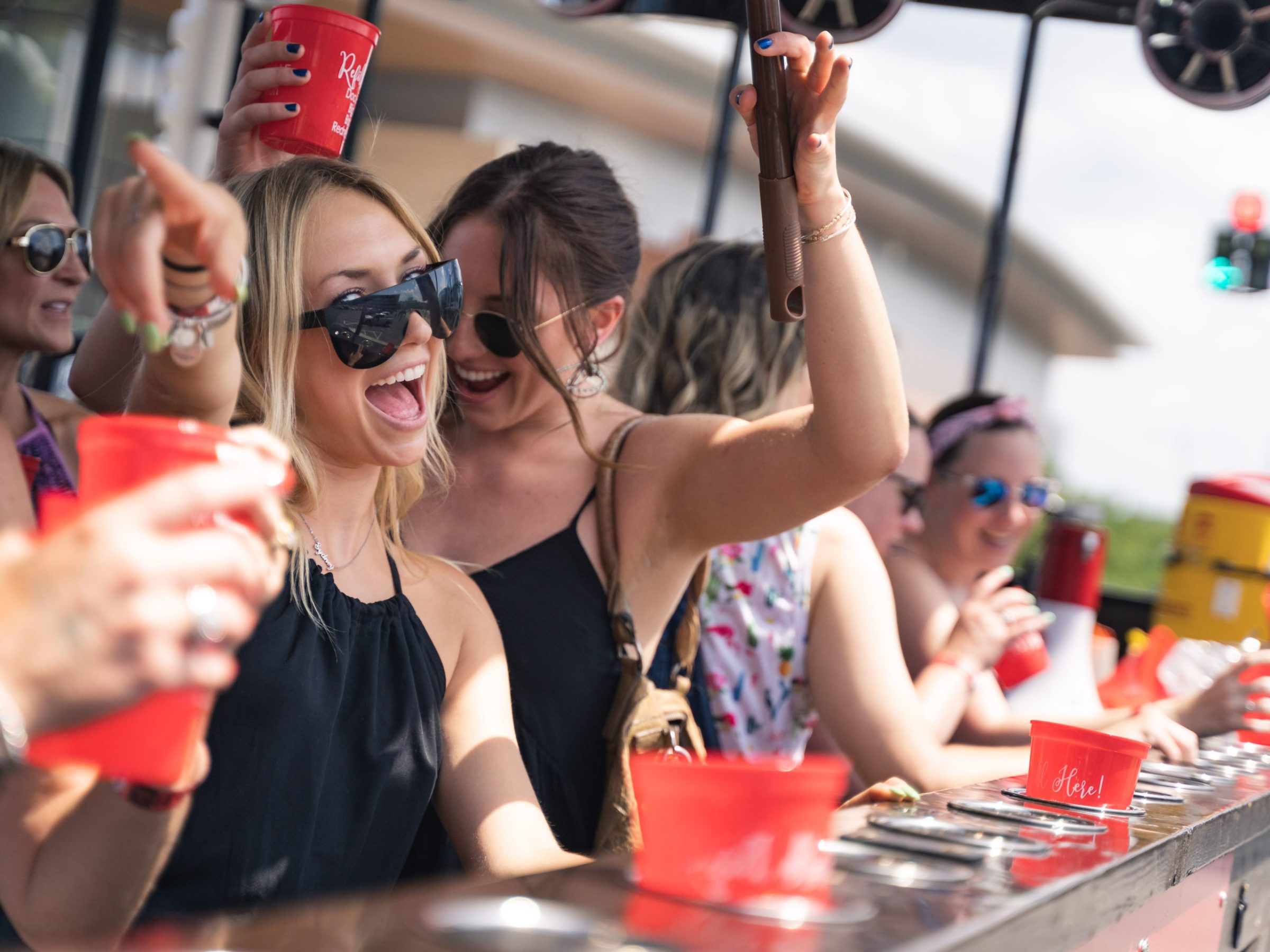 a group of people looking at a cell phone