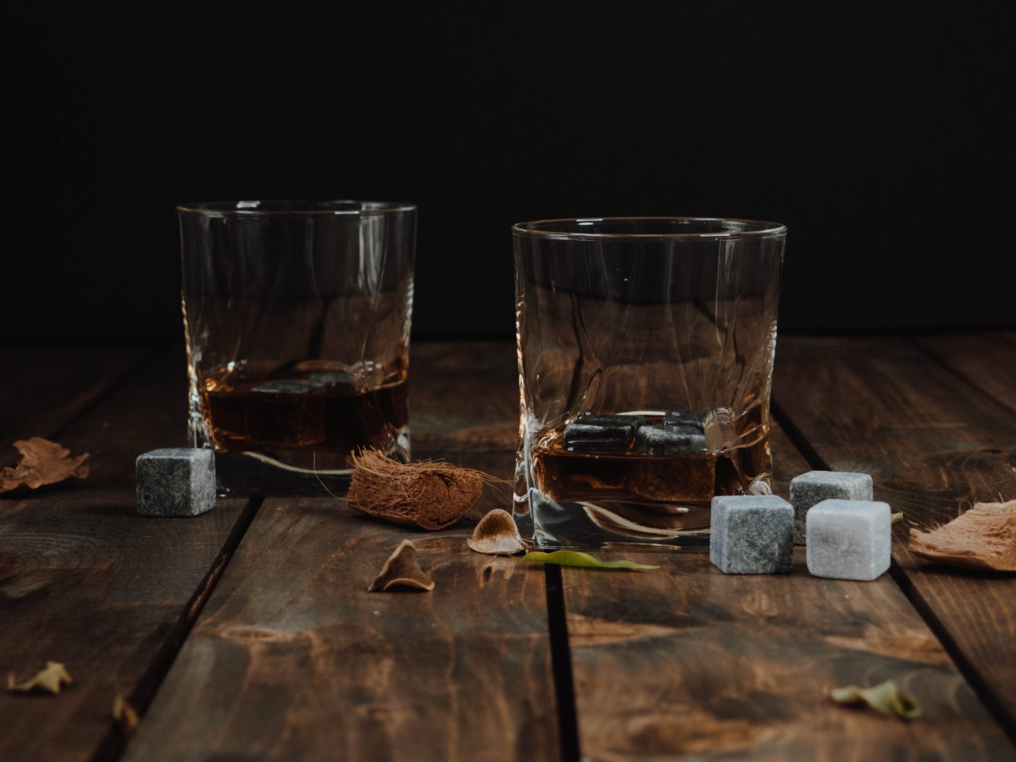 nashville distilleries – glasses a glass of wine sitting on top of a wooden table